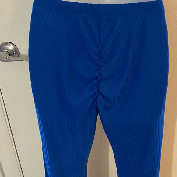 Blue high waisted stretch pants with cinched butt. - Picture 3 of 3